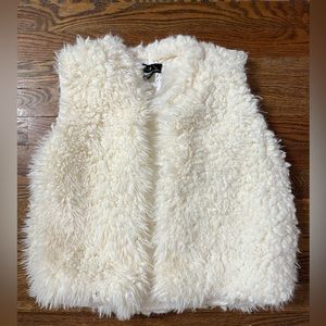 White fur vest